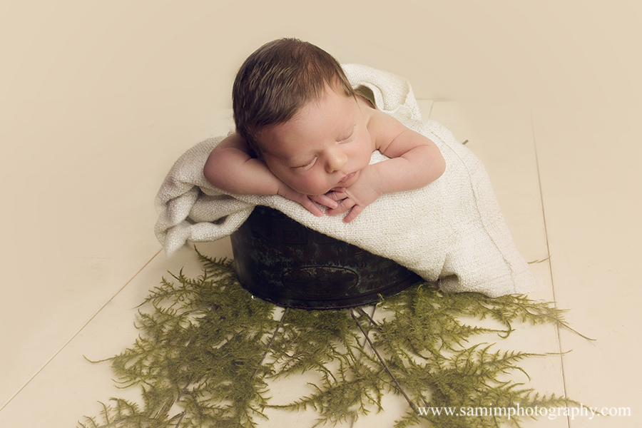 SamiM Photography little boy's newborn session greenery fern leaves