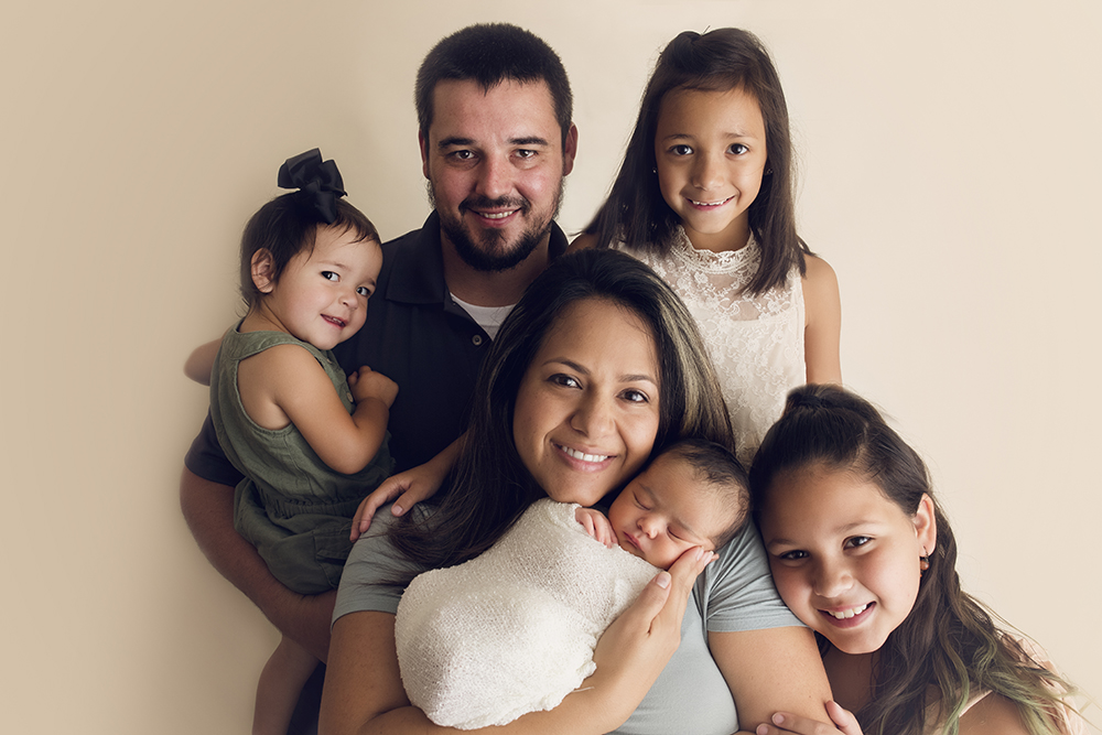 Cream Newborn Studio Session family of 6 newborn posing