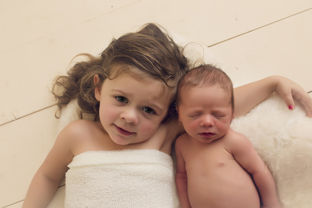 neutral newborn session newborn sibling toddler image